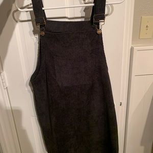 black corduroy overall-like dress with pockets